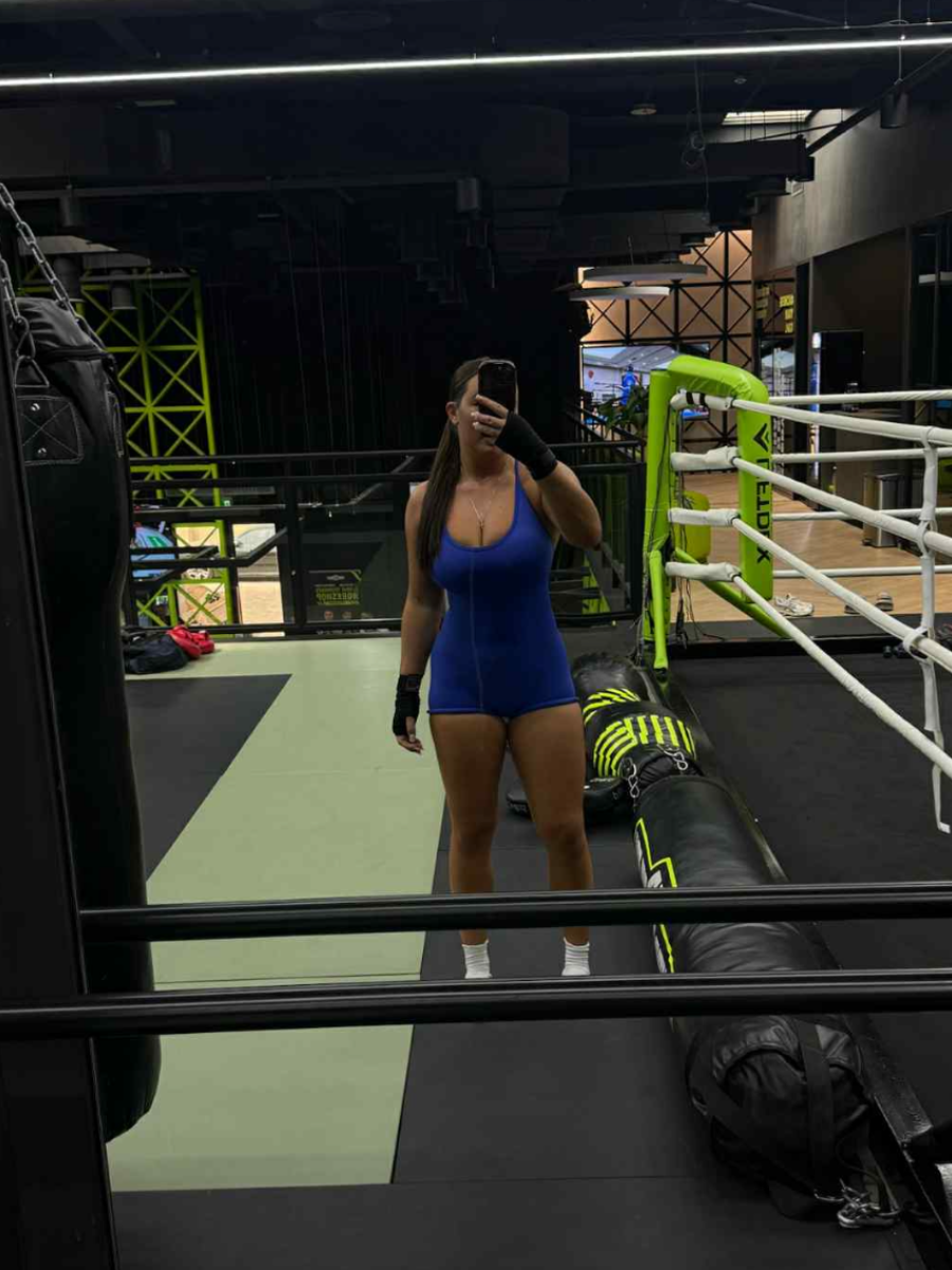 Ascend Active royal blue unitard in boxing gym, confident full-body fit